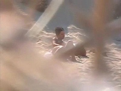 Voyeuring horny nudist girl fingering in public