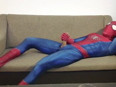 Horny Spiderman jerks off and cums massive load