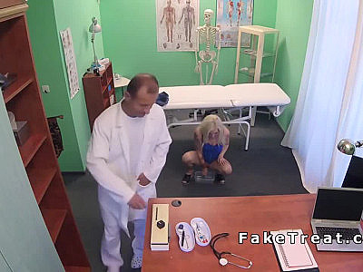 Doctor Helping Petite Blonde Patient To Giving Sample